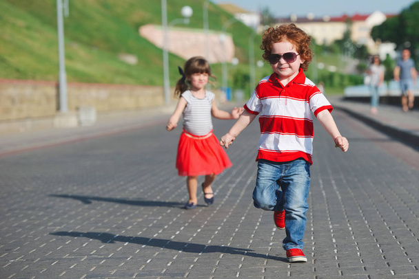 two happy children running on the promenade - Zdjęcie, obraz