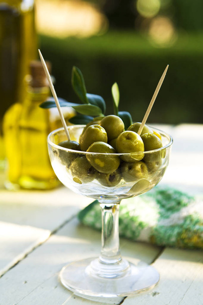 Glass filled with olives - Photo, image