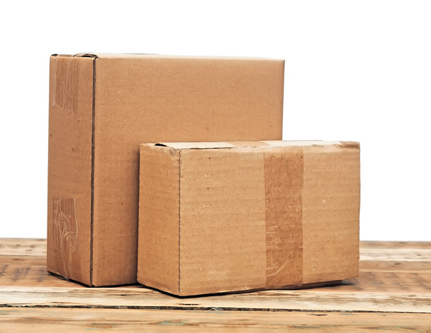 cardboard boxes on a wooden background - Photo, Image