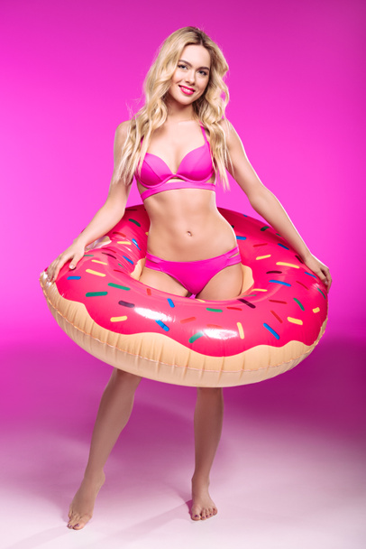 Girl in swimsuit with swimming tube  - Fotografie, Obrázek