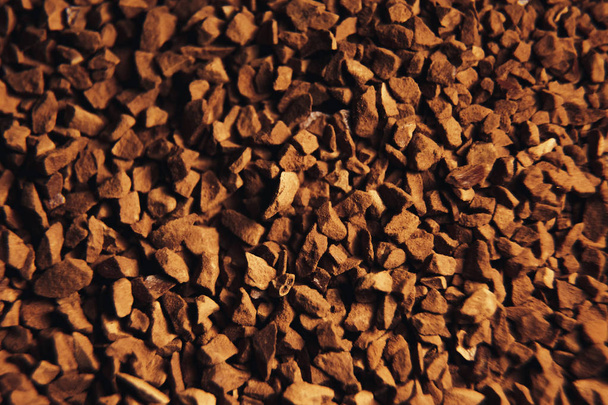 Instant coffee granules scattered brown closeup. - Foto, Bild