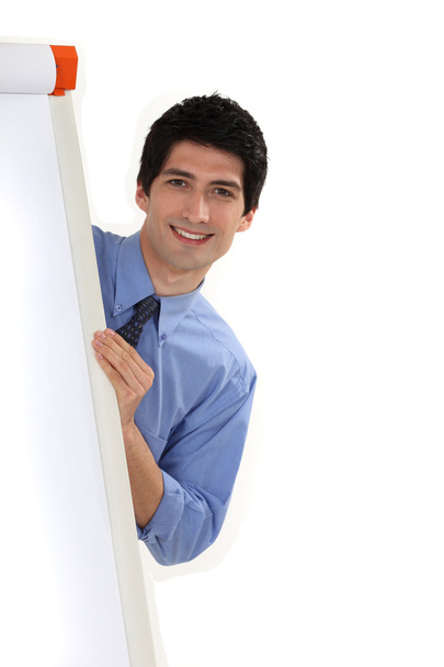 Businessman standing behind a white board - Photo, Image