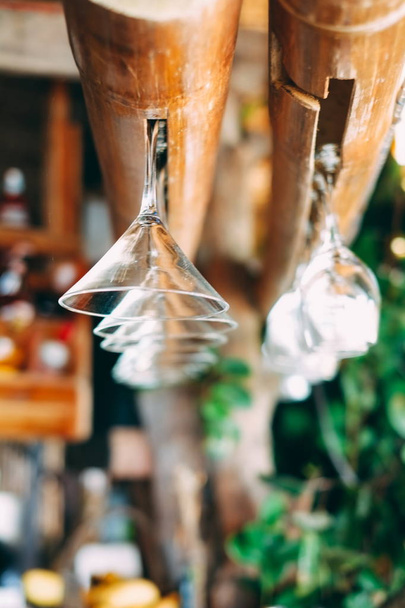 Hanging glasses in bar on the beach , shallow focus  - Foto, imagen