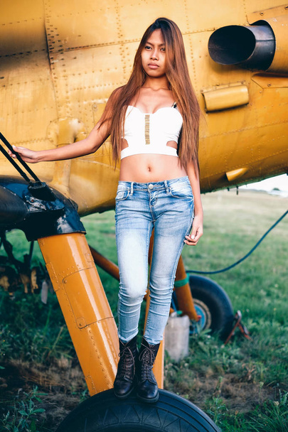 Beautiful female portrait on the airfield,late afternoon - Fotografie, Obrázek