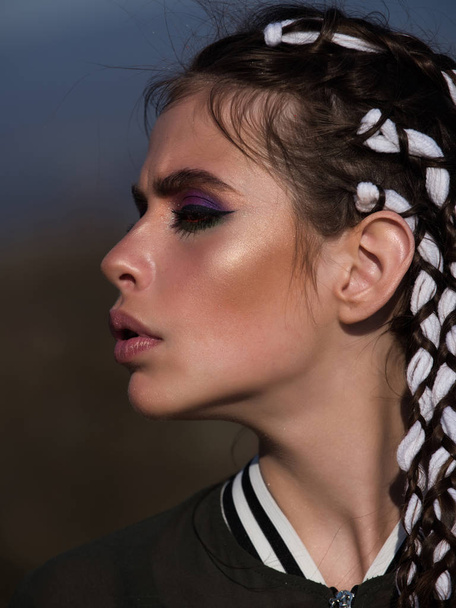 fashion woman with sexy lips, makeup and long braids - Valokuva, kuva