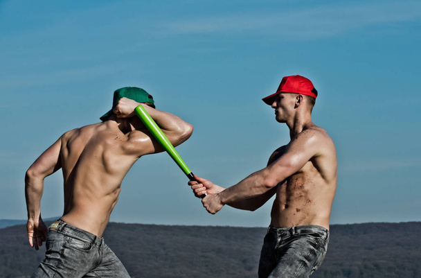 young people of men with baseball bat in hand - Photo, image