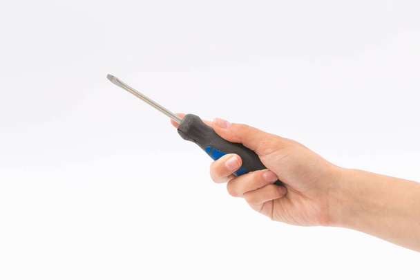 Female hands on a white background with a screwdriver - Foto, Imagen