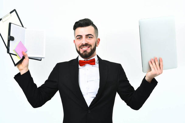 Smiling employer in classic black suit and red bow tie - Фото, изображение
