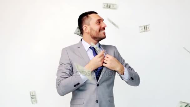 happy businessman with packets of dollar money - Video, Çekim