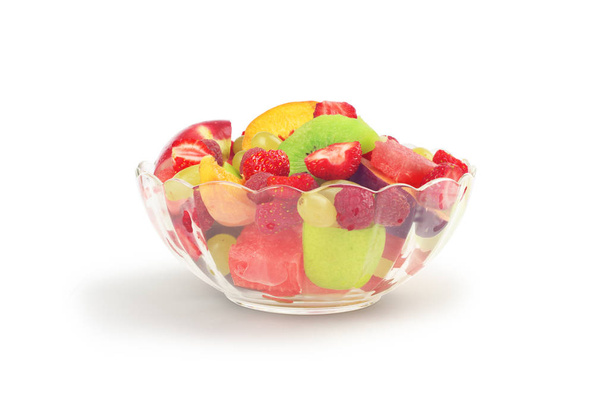Fruit salad in glass bowl isolated on white - Fotoğraf, Görsel
