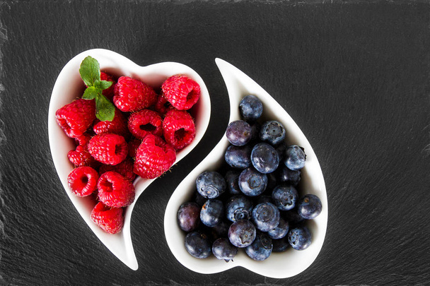 blueberries and raspberries in the white dish - Photo, Image