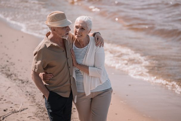 Senior couple walking on beach  - Photo, Image