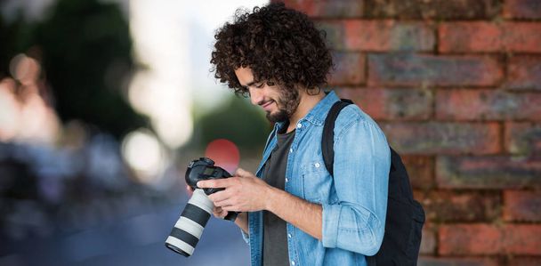 male photographer operating camera  - Foto, Bild