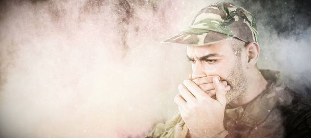soldier covering his mouth - Foto, Bild