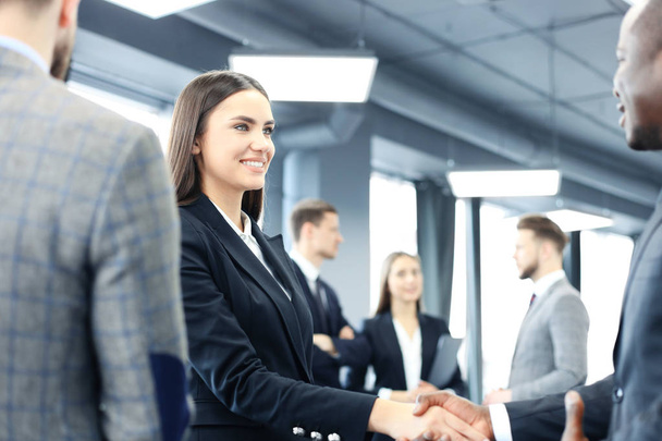 Business people shaking hands, finishing up a meeting. - Φωτογραφία, εικόνα