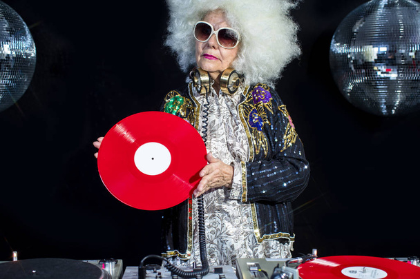 dj grandma in disco setting - Photo, Image