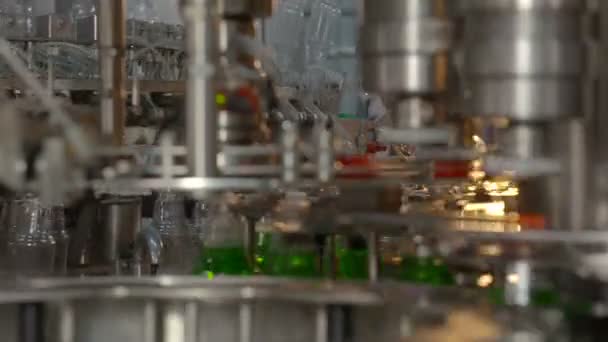 Bottling of lemonade in plastic bottles. Lemonade bottle conveyor industry. - Footage, Video