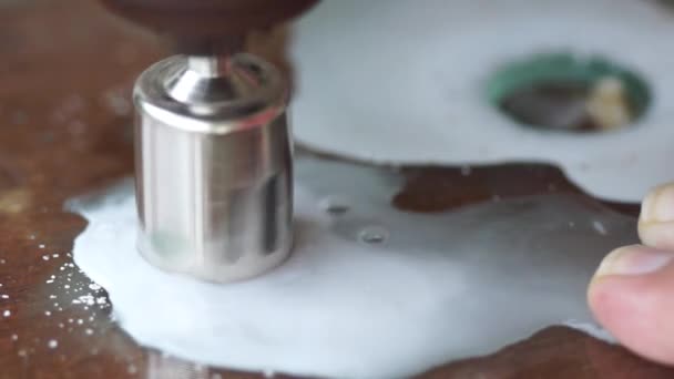 Diamond coated keyhole cutter drills through glass sheet glass revealing cookie - Footage, Video