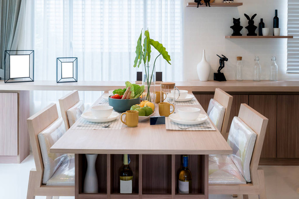 Wooden table and chair in modern dinning room at home. Interior  - 写真・画像