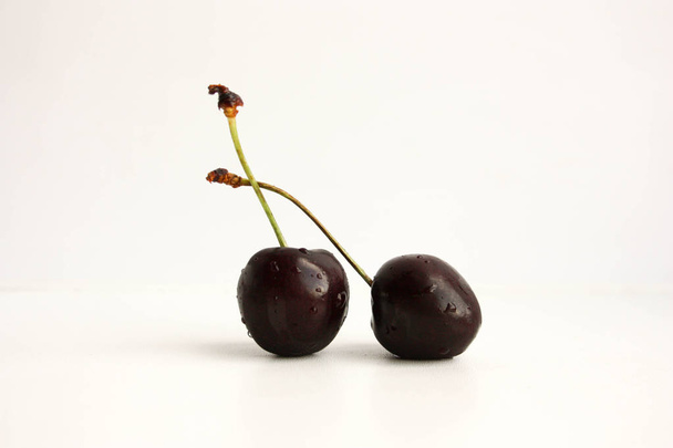 Cherry on white two berries - Valokuva, kuva