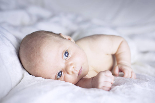 Beautiful baby girl on white blanket - Zdjęcie, obraz
