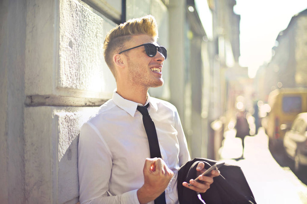 Blond businessman feeling happy outside - Fotó, kép