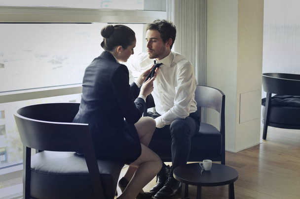 Woman tying man's tie inside - Photo, Image