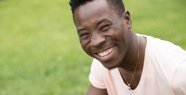 African american man giggling in a nature - Фото, зображення