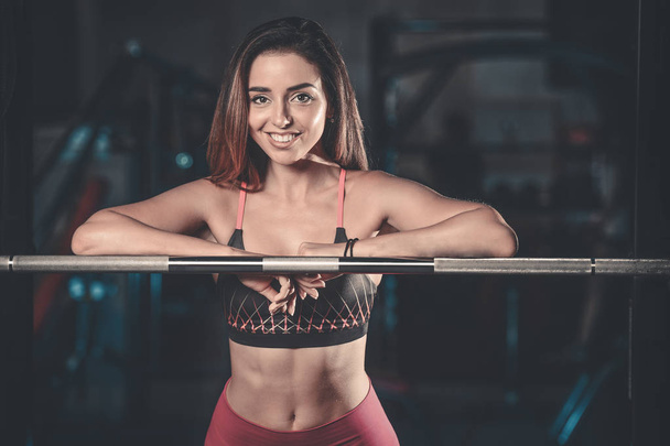 Girl execute exercise with barbell - Foto, Imagem
