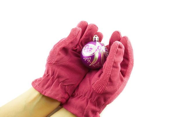 gloves.female 手のクリスマス ボールを保持しているピンクの手袋 - 写真・画像