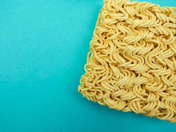 top view of Instant noodles on a blue background, space for text, food, health - Photo, Image