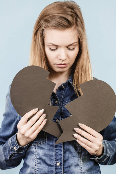 Young woman with broken heart - Фото, изображение