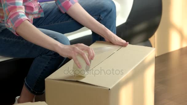 Hands of woman packing box. - Footage, Video