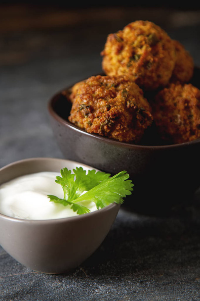 Middle Eastern traditional dishes. Falafel with sour cream. Vege - Foto, Imagen