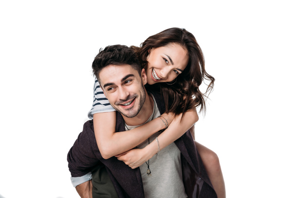 jeune couple souriant faisant piggyback
 - Photo, image