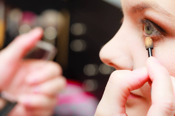 Close up woman getting make up, eyeshadow - Фото, изображение