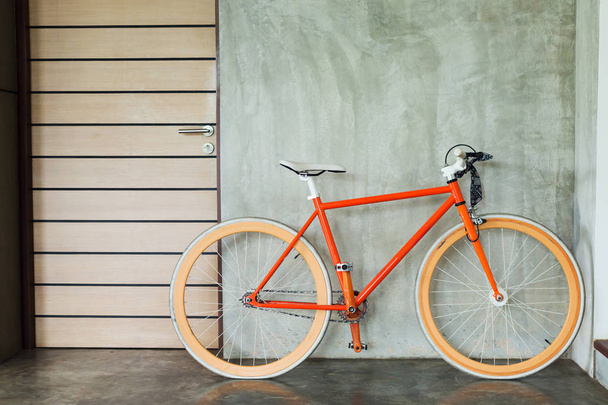 orange bicycle parked decorate interior living room modern style - Zdjęcie, obraz
