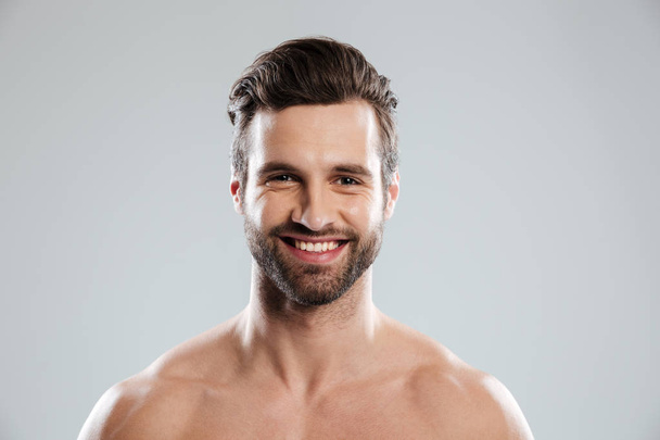 Portrait of a smiling young bearded man - Photo, Image