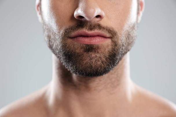 Cropped image of a half mans face with beard - Foto, imagen