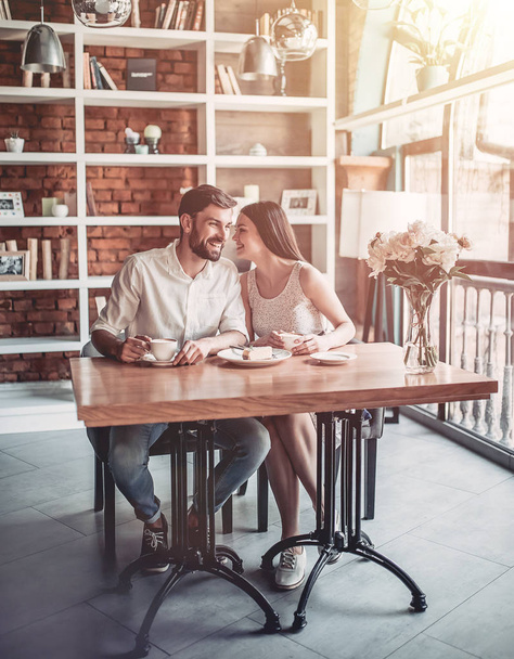  couple in love is sitting in cafe - Фото, изображение