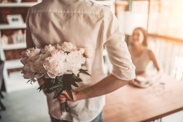  man is presenting flowers - Photo, Image