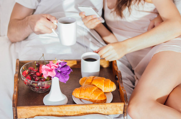 Couple having breakfast in bed - Photo, Image