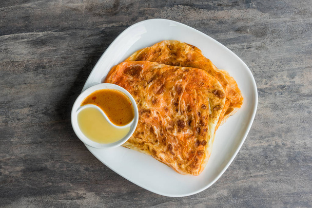Indian Roti Prata with Condensed milk and Curry Sauce - Photo, Image