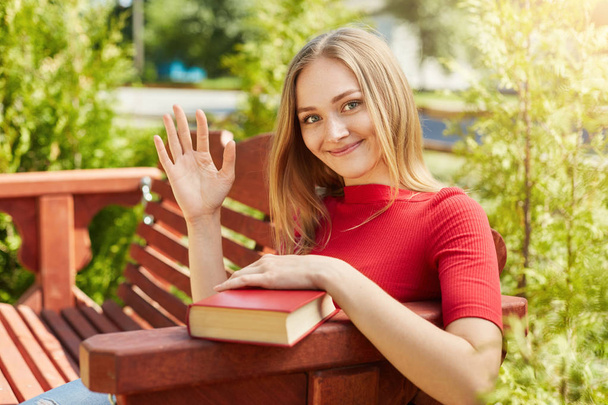 Female student holding book  - Fotografie, Obrázek