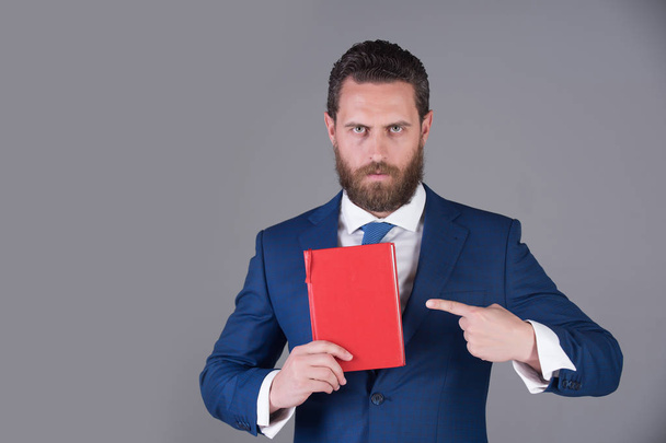 notebook in hand of man, businessman in blue outfit - Fotoğraf, Görsel