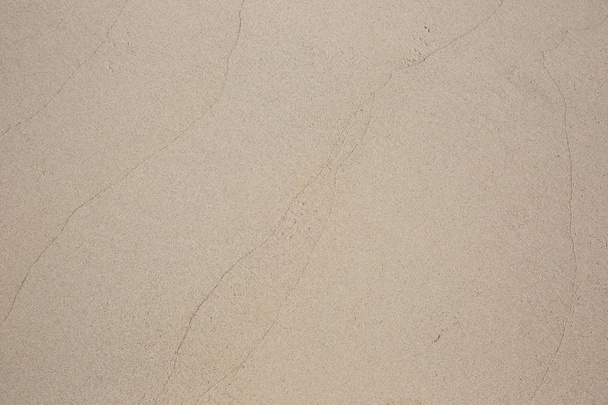 closeup of sand pattern of a beach in the summer - 写真・画像