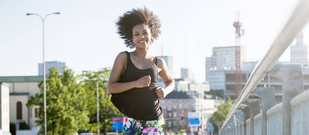 Young african american girl running. - Fotó, kép