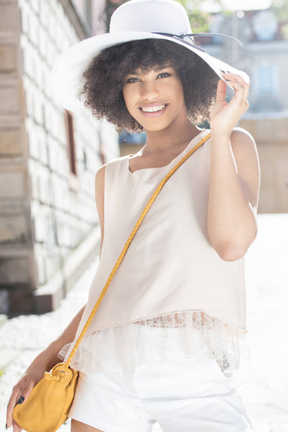 Girl with afro posing, smiling. - Foto, afbeelding