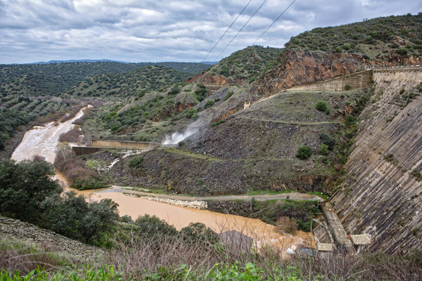 Reservoir Jandula, expelling water after several months of rain, Jaen, Spain - Photo, Image