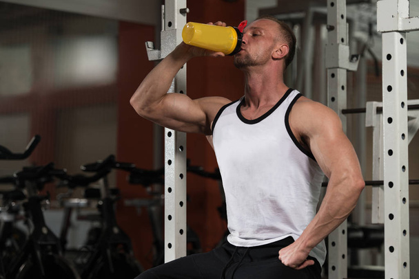 Bodybuilder Drinking Water From Shaker - Photo, Image